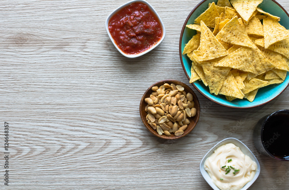 Mexican nachos chips on wooden background Mexican nachos chips on wooden background