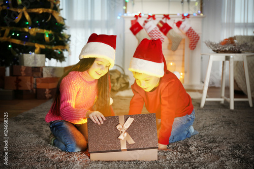 Cute little kids in Santa h...
