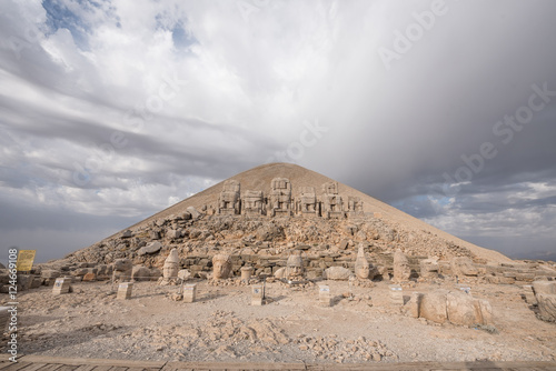 Mount Nemrut at sunrise with the head in front of the statues. The UNESCO World Heritage Site at Mount Nemrut where King Antiochus of Commagene is reputedly entombed