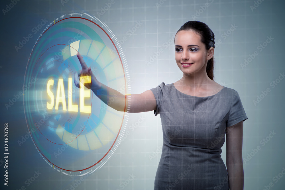 Businesswoman pressing buttons in sale concept Businesswoman pressing buttons in sale concept