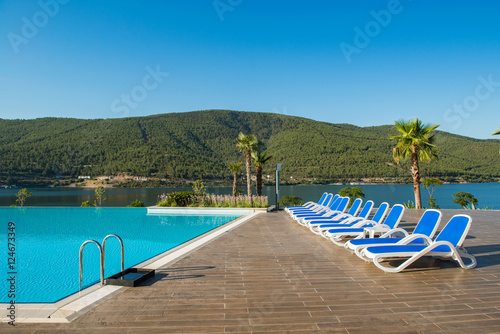 Nice swimming pool outdoors on bright summer day