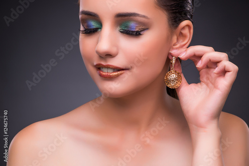 Beautiful woman with jewellery in beauty concept