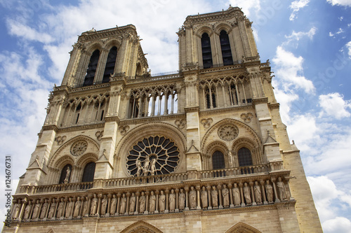 Close up view of Notre Dame Cathedral in Paris. Towering, 13th-century cathedral with flying buttresses & gargoyles, setting for Hugo's novel.