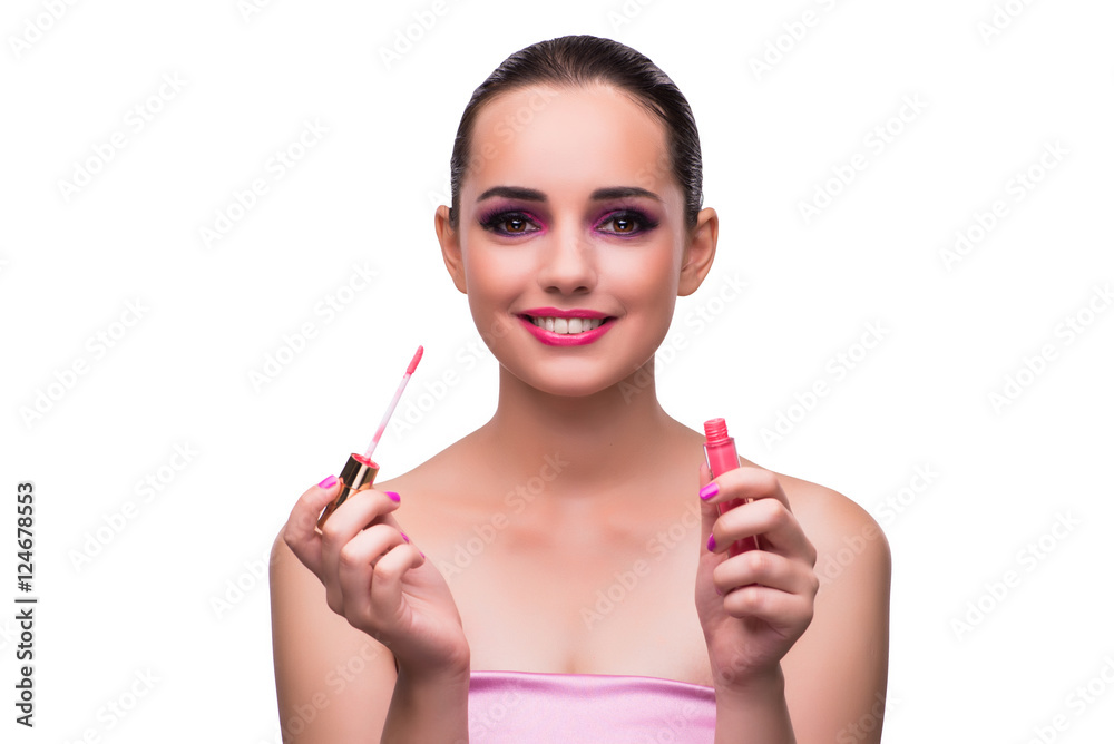 Woman applying lipstick isolated on white Woman applying lipstick isolated on white