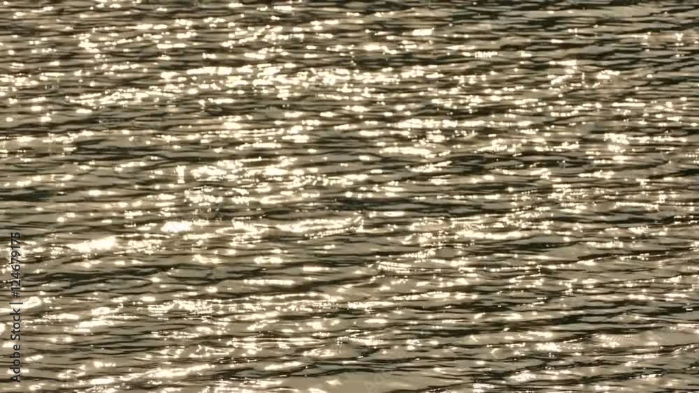 Sunset light reflected a beautiful golden from reservoir in summer evening Sunset light reflected a beautiful golden from reservoir in summer evening