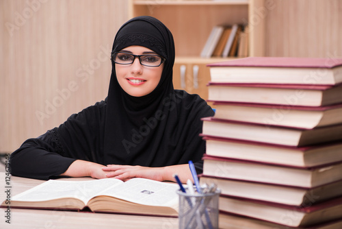 Woman muslim student preparing for exams