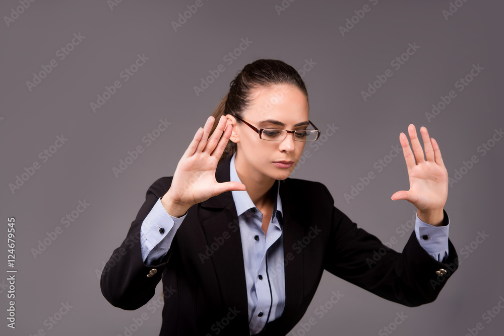 Young woman businesswoman pressing virtual buttons Young woman businesswoman pressing virtual buttons