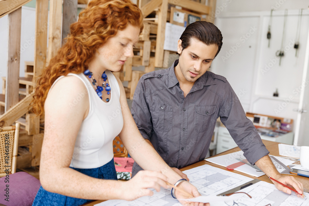 Two young architects in office Two young architects in office