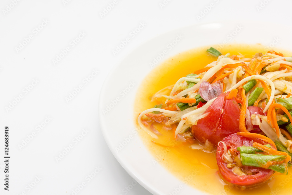 Spicy green papaya salad or somtum isolated on white background with copy space for text, Thai cuisine Spicy green papaya salad or somtum isolated on white background with copy space for text, Thai cuisine