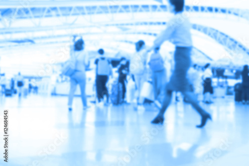 People traveling at airport terminal in blurred motion with retro color effected, Abstract blur people background