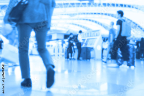 People traveling at airport terminal in blurred motion with retro color effected, Abstract blur people background