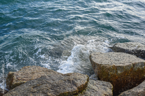 waves breaking on the shore with sea foam