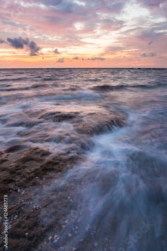 Long exposure sea and rocks at twilight