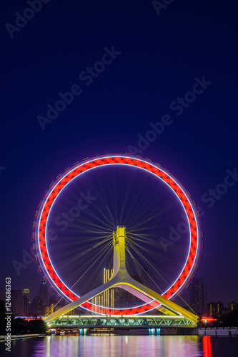 Fototapeta Naklejka Na Ścianę i Meble -  Night scene cityscape of Tianjin ferris wheel,Tianjin eyes with