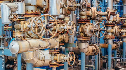 Industrial zone,The equipment of oil refining,Close-up of industrial pipelines of an oil-refinery plant.