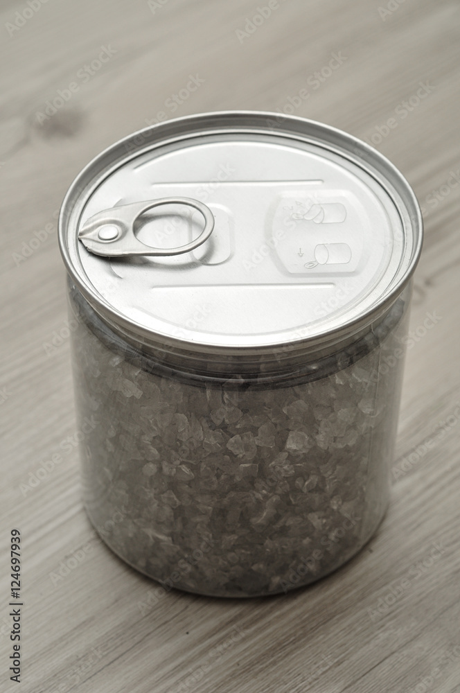See through tin with a metal lid with key filled with Grey glass See through tin with a metal lid with key filled with Grey glass