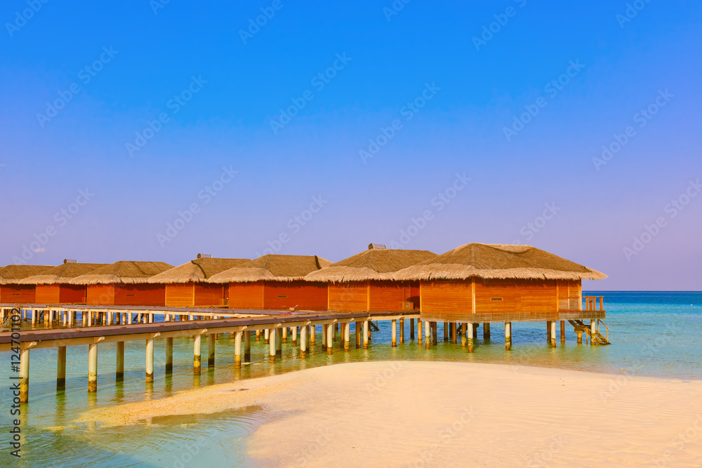 Bungalows on tropical Maldives island Bungalows on tropical Maldives island