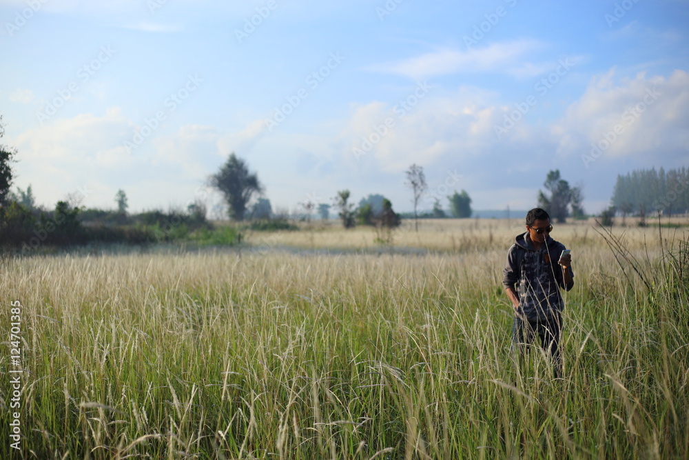 Man and White field grass flower at Thailand Man and White field grass flower at Thailand