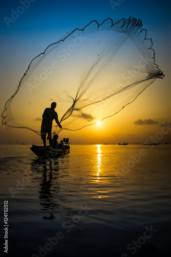 silhouette of fisherman.
