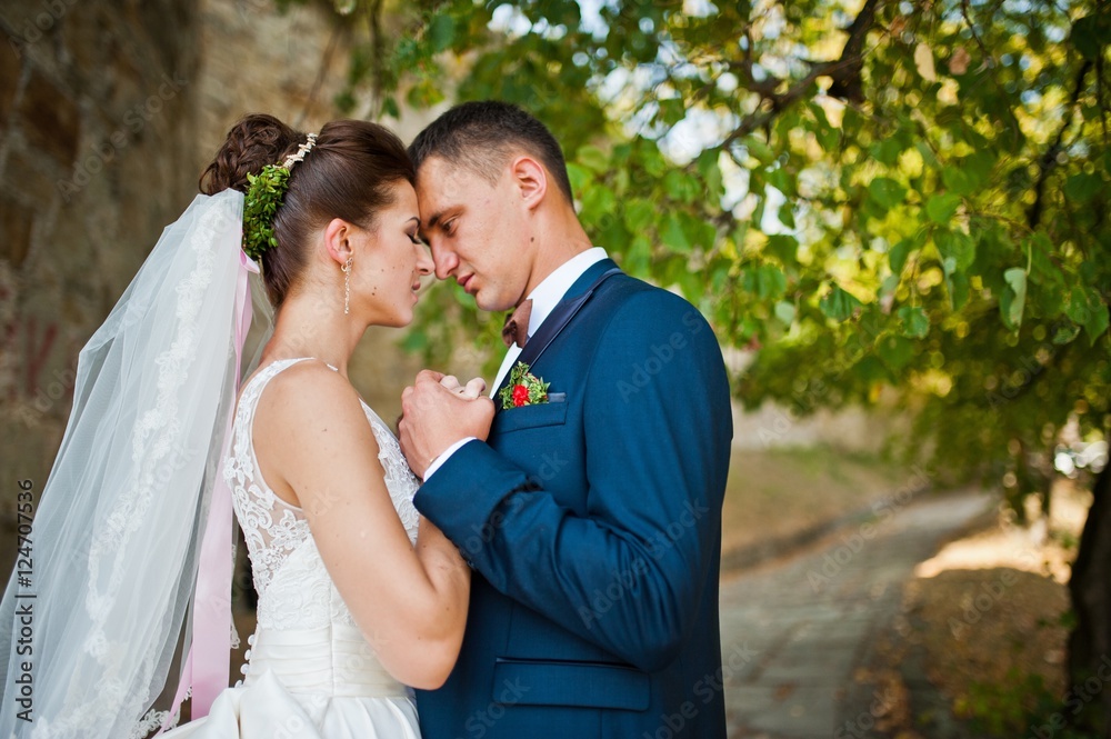 Gorgeous wedding couple at autumn park in love Gorgeous wedding couple at autumn park in love