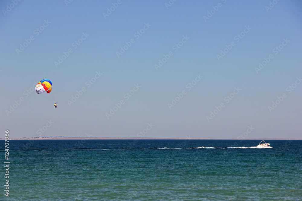 The motorboat rolled tourists on a parachute. Maritime space. The motorboat rolled tourists on a parachute. Maritime space.