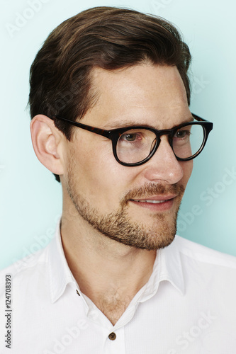 Fototapeta Naklejka Na Ścianę i Meble -  Handsome man in spectacles, looking away