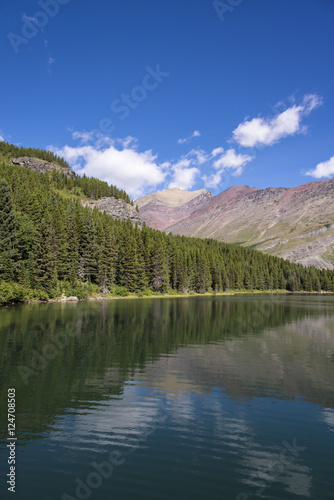 Reflection of landscape on the lake in Glacier National Park photo