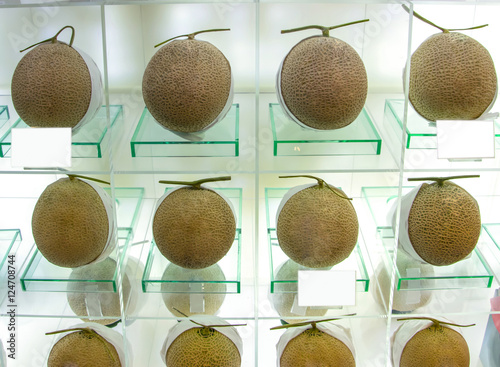 Perfect ripe melons at the fine shop. It?s a customary in Japan to give expensive fruits as presents for special occasions like weddings, business transactions, and even hospital visits