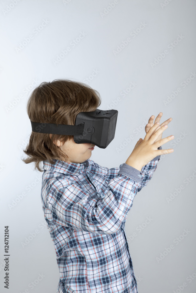 boy with glasses of virtual reality, child tries new technology boy with glasses of virtual reality, child tries new technology
