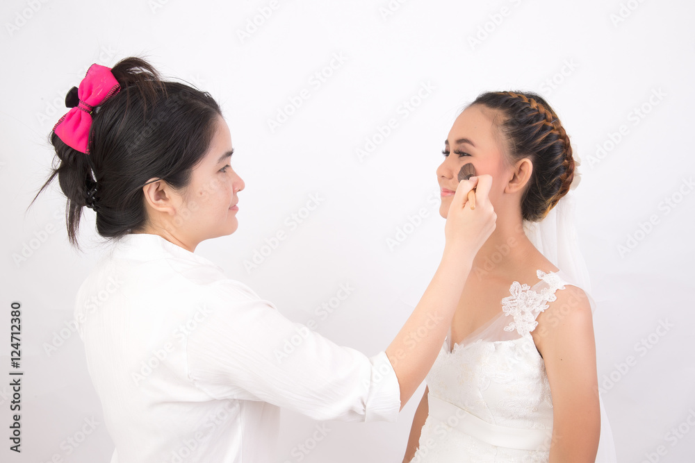 Professional Make-up artist doing glamour model makeup at work Professional Make-up artist doing glamour model makeup at work