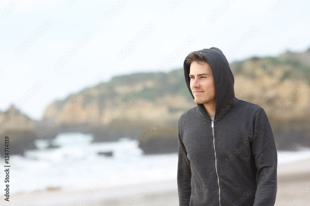 Confident teenager walking on the beach Confident teenager walking on the beach