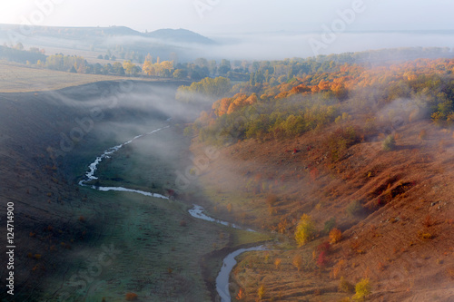 autumnal foggy sunrise