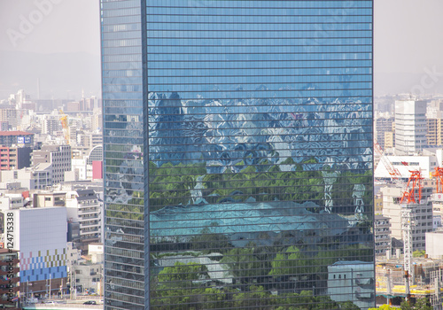 Japan  Osaka - City skyline with modern building glass reflection.