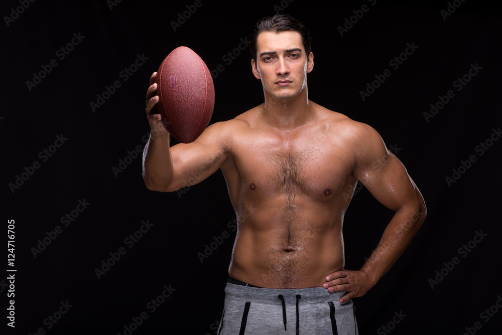 Ripped muscular man with american football Ripped muscular man with american football