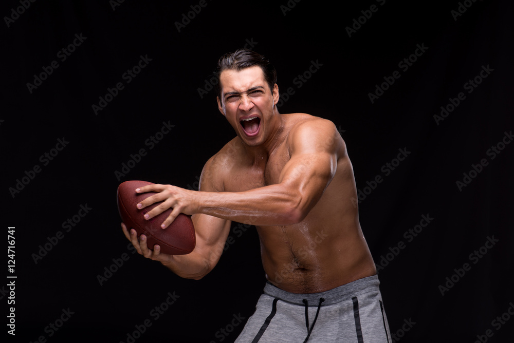 Ripped muscular man with american football Ripped muscular man with american football