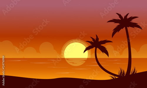 Silhouette of beach at sunset with reflection