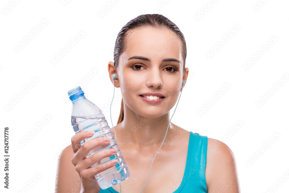 Woman doing sports with bottle of fresh water Woman doing sports with bottle of fresh water