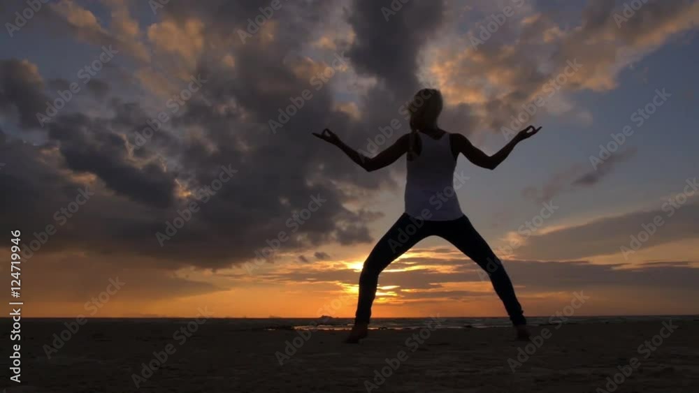 Woman Practicing Yoga at Sunset Beach Woman Practicing Yoga at Sunset Beach