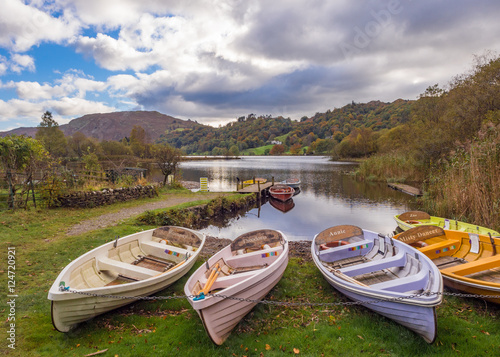 Rowing boats on Lake Grasmere at Autumn, Cumbria, UK photo