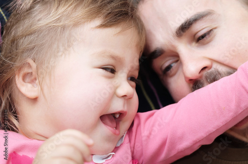 Tableau sur toile cheerful kid and daddy having fun laughting very emotional