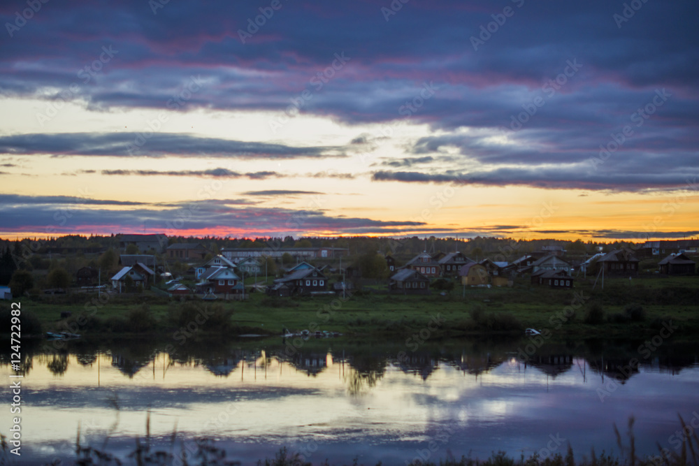 Russian village. Sunset over the river