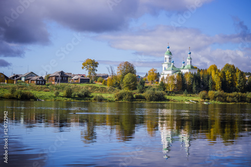 Russian village. Church near the river.