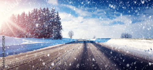 Car on winter road covered with snow © candy1812