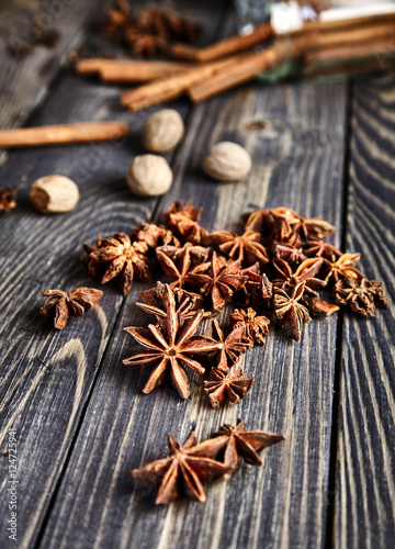 Heap of anise stars on wooden table