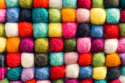 Geometric background with balls of colored synthetic wool © puckillustrations