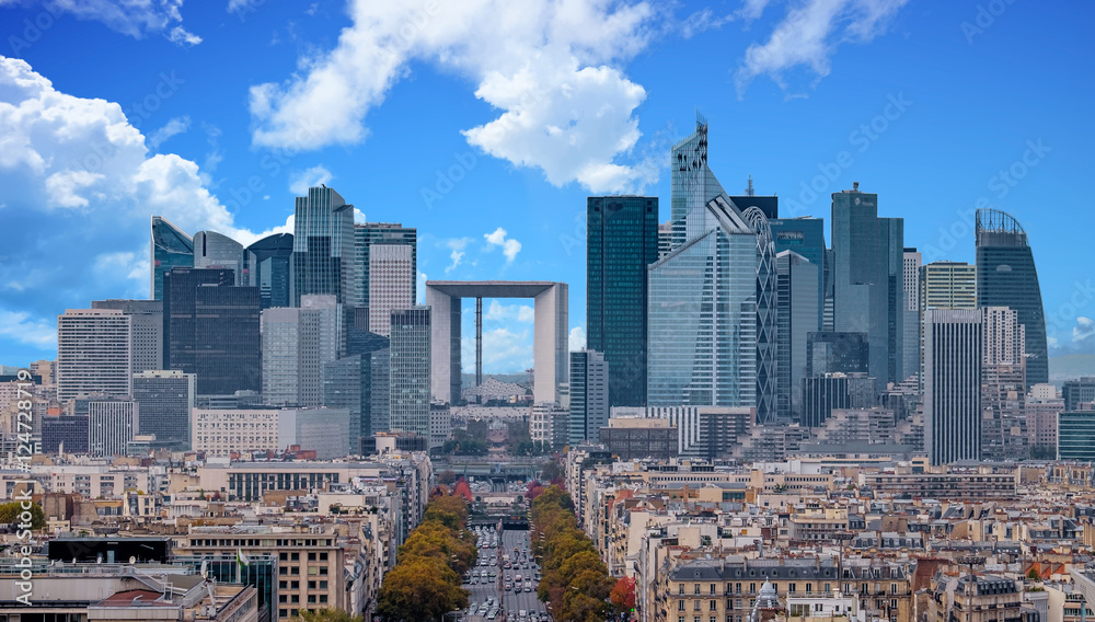 La Defense Financial District Paris France in autumn. Traffic on Champs-Elysees with orange and yellow trees aside. Modern vs. Old architecture. Blue sky with clouds. - obrazy, fototapety, plakaty 