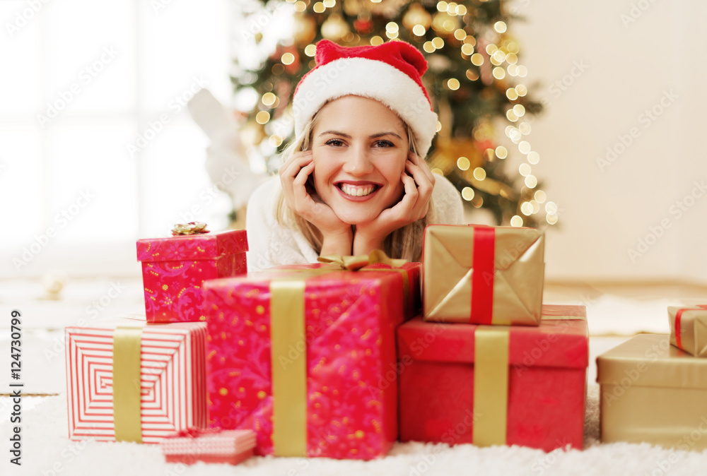 Young, beautiful woman with Christmas presents  