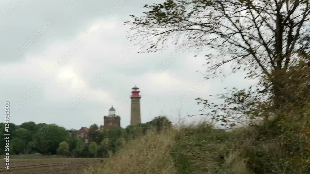Lighthouse of Cape Arkona at Putgarten. Fields and meadow around. Autumn leave. Baltic sea coast. (Mecklenburg-Vorpommern, Germany). Stormy weather.