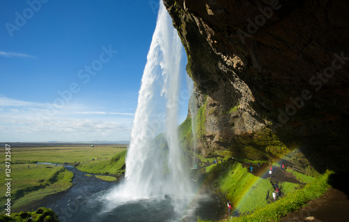 Waterfall Seljalandsfoss with rainbow in Iceland.
