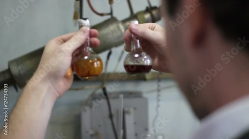 scientist selects reagent in laboratory for experiments